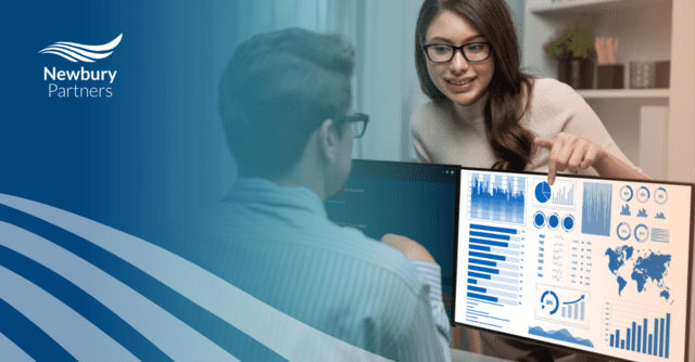 Professional reviewing detailed dashboard with charts demonstrating staffing analytics tools.
