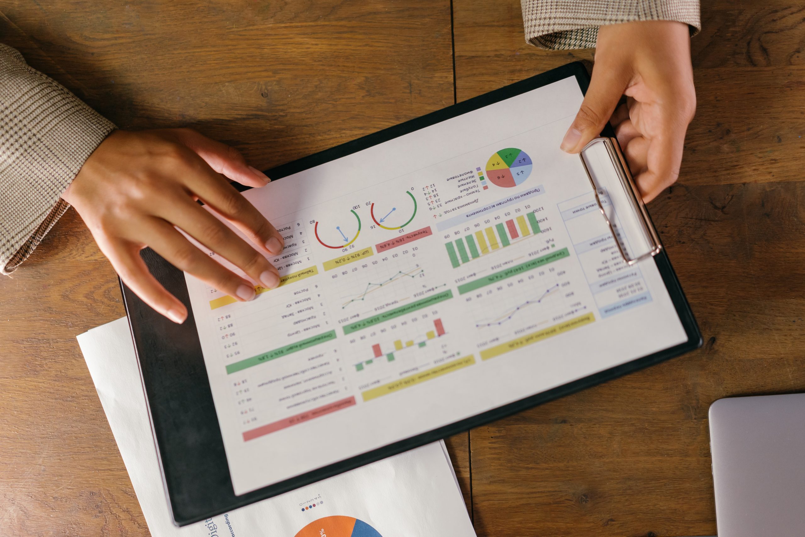 Business professional reviewing data on a laptop