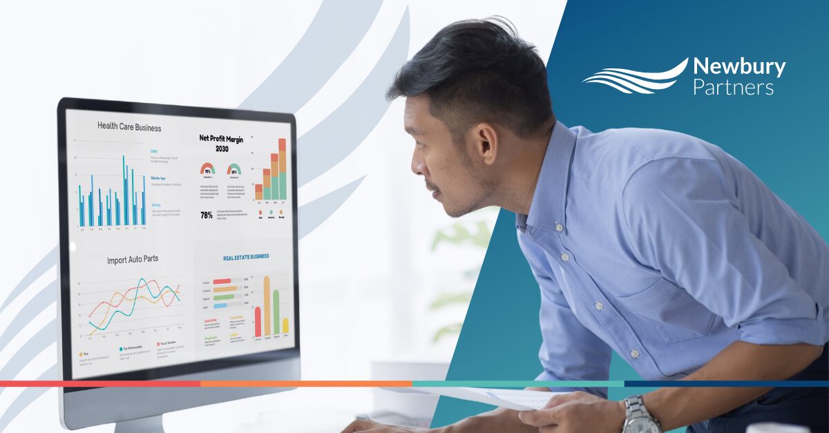 "Business professional analyzing commission dashboard to automate commissions with graphs and charts on computer screen