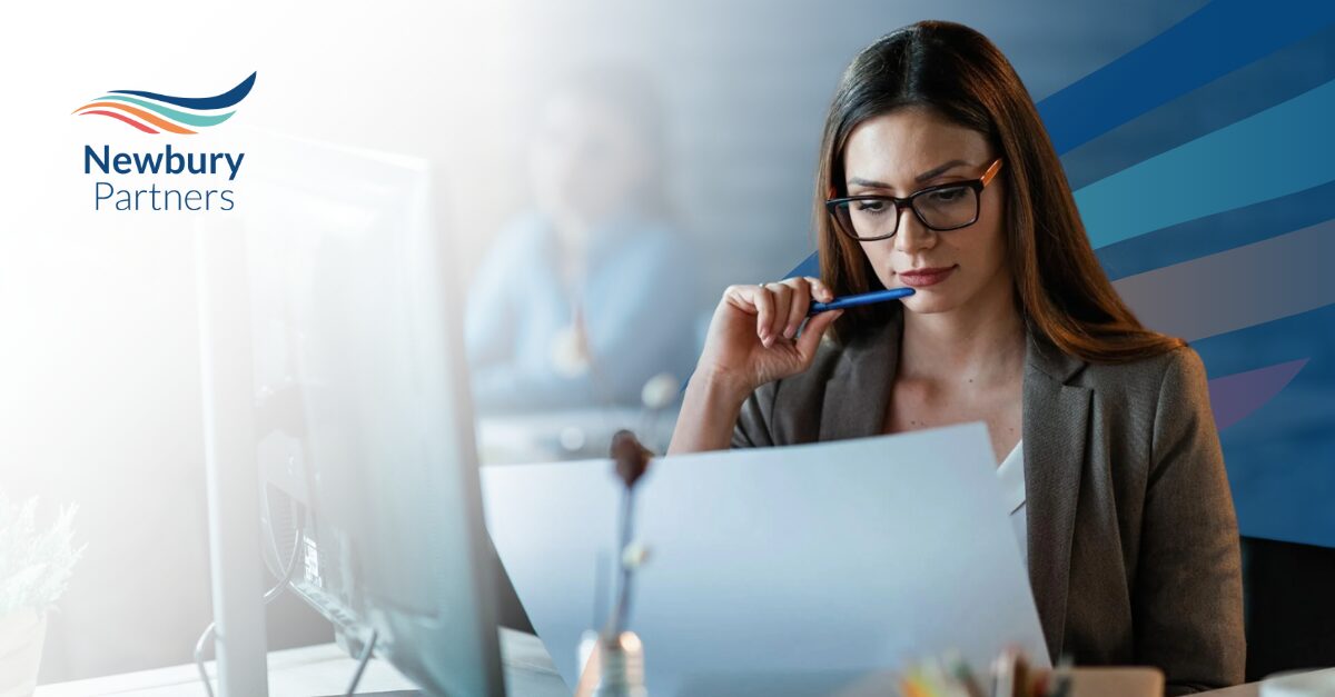 Business professional reviewing software documentation related to Bullhorn release notes.