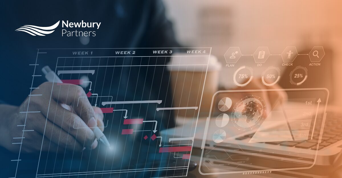 Business professionals evaluating performance data to demonstrate Bullhorn managed services ROI.